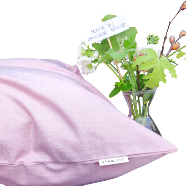 Rosa hovedpude og glasvase